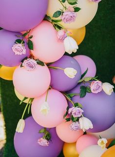 balloons with flowers and greenery on them