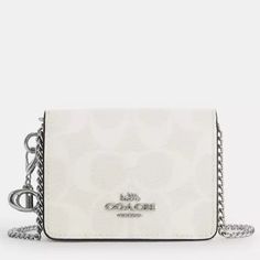 Coach Boxed Mini Wallet On A Chain In Signature Canvas New In Packaging Style Number Cn990 Measurements Length: 4.0" Height: 3.0" Width: 1.0" Materials Signature Coated Canvas And Smooth Leather Fabric Lining Strap Detachable Chain Strap With 23.25" Drop For Shoulder Or Crossbody Wear Features Outside Open Pocket Snap Closure Two Credit Card Slots Includes Removeable Charms Coach Mini Wallet, Y2k Shoulder Bag, Coach Crossbody Purse, Vintage Coach Bags, Nylon Handbag, Leather Camera Bag, Satchel Tote Bag, Leather Saddle Bags, Small Crossbody Purse