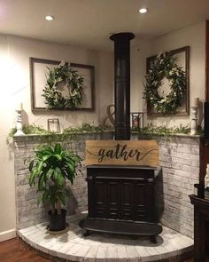 an old fashioned stove in the corner of a room with potted plants on it