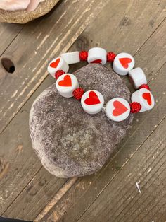 Description You can wear your heart on your wrist by wearing this bracelet. These Red and White ceramic beads are shaped like hearts with a bright red sparkly round bead in between Details White and red 16mm x 9mm bead size Lentil with heart print Ceramic fits 7- 8" wrist Features One of a kind, fashion jewelry, everyday jewelry Great gift for that special girl, anniversary gift, birthday gift or gift to say how much you care. Check out the rest of our store for other great products!Fast Shippin Cheap White Heart Bracelet For Valentine's Day, Cheap Valentine's Day Bracelets With Round Beads, Casual Stretch Bracelet For Valentine's Day, Cheap White Beaded Bracelets For Valentine's Day, Heart Bead Bracelet, Jewelry Everyday, Ceramic Heart, Special Girl, Elastic Bracelet