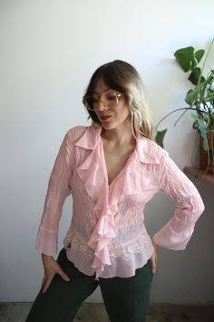 DETAILS:: //  Vintage 2000s light pink pastel ruffle blouse. Long sleeves, flared at wrists. pretty lace detailing. Sheer. Good vintage condition, light wear. no holes or stains.  Allison Taylor large 100% Polyester Check the measurements and model information to see if this would be a good fit for you!  Measurements are taken flat in inches and doubled at the bust, waist and hips. On some pieces I provide two sets of measurements on the bust waist and hips. First measurement is taken unstretched and the second stretched to show how much the material stretches and it's size versatility. Sleeve width is taken flat at the shoulder, measuring the width of the armholes. Please convo me if you need additional measurements!  Measurements //  Sleeve length: 19" Sleeve width: 8" Shoulder: 16" Bust Pink Pastel, Vintage 2000s, Pink Lace, Flared Sleeves, Womens Clothing Tops, Light Pink, Sleeve Blouse, Blouses For Women, Ruffle Blouse