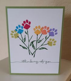 a greeting card with colorful flowers and the words thinking of you