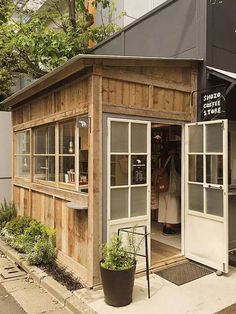 a small store with lots of windows on the outside