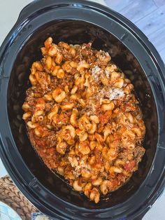 a slow cooker filled with macaroni and cheese