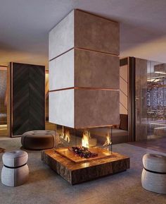 a living room with a fire place in the center