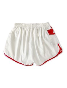 Love the classic white with red piping on these retro 1960's shorts with extra special side pocket with button. Elastic waistband and built in nylon undershorts. We had to hunt for the brand, in tiny stitching the tag says K-Mart, which is AMAZING. Thick quality canvas fee. Fabric: 65% Polyester, 35% Cotton Details: 2 back pockets, 2 side pockets, knee length bermuda, flap tab button front with zip Size: Tag says "Fits 36-38" modern sizing would suggest these fit a size women's medium, or men's Retro White Shorts With Pockets, Retro White Summer Shorts, White Retro Bottoms With Pockets, Retro White Bottoms With Pockets, Retro White Short Bottoms, White Sporty Athletic Shorts With Side Pockets, Sporty White Athletic Shorts With Side Pockets, White Bottoms With Contrast Trim, Short Length, White Athletic Shorts With Pockets