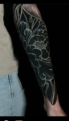 a man's arm with flowers on it and the words top 10 tattoos for men