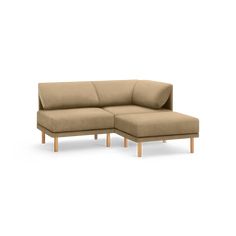 a small sectional couch with wooden legs and a beige fabric upholstered backrest