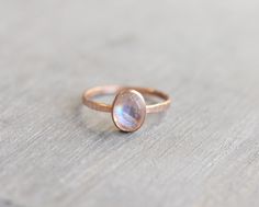 14k Rose Gold Filled Hammered Ring with 8x6mm genuine rainbow moonstone. Stackable ring. The ring is 14k rose gold filled so it is very durable. It will not tarnish if it gets wet and will hold the color. Also available in sterling silver. https://www.etsy.com/shop/LyndyLouDesigns?ref=listing-shop-header-item-count&search_query=rose+gold+gemstone+rings This ring is made to order in your size. If you don't see your size available please feel free to message me. All orders ship in a gift box. Rose Gold Moonstone Ring As A Gift, Dainty Rose Gold Moonstone Ring, Gold Gemstone Rings, Aquamarine Stacking Ring, Rose Gold Moonstone Ring, Gold Moonstone Ring, Ring Moonstone, Gold Gemstone Ring, Rainbow Moonstone Ring