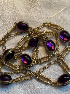 Gorgeous 80's station necklace featuring purple double cabochon links Heavily gold plated  It measures 34 inches in total length  In good condition with little wear to the gold plate  To nice to sit in the drawer 🙂 Chili Board, Purple Necklace, Station Necklace, Long Chain, Chains Necklace, Favorite Jewelry, Violet, Gold Plate, Accessory Gift