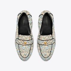 Our Ballet Loafer® is an interpretation of two classics — the flexibility of a ballet slipper with the profile of a loafer. The insole provides performance-level comfort, ruched sides secure the foot and treads on the outsole add traction. It is crafted in printed sequin mesh and detailed with a Double T in brushed gold. The shoe's edges are hand-painted and the strap is hand-stitched. Designer Flats, The Ballet, Loafers Style, Ballet Slippers, Sport Sandals, Footwear Design Women, Hand Stitched, Low Heels, Ballet Flats