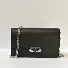 New With Tag Michael Kors Cece Medium Shoulder Crossbody Bag Clutch Vegan Leather Black Silver Toned Hardware 100% Authentic Retail: $448.00 Plus Tax *Please See The Measurement For The Size* Tag Said Medium But The Bag Is Small No Dust Bag Flap Closure Michael Kors Logo At Front Custom Fabric Lining 3 Card Slots 8.75" (L) X 5.5"(H) X 2.5"(D) Adjustable & Detachable Long Strap Very Clean, Smoke-Free And Pet-Free Environment. Chic Wallet On Chain With Branded Hardware, Everyday Black Flap Bag With Silver-tone Hardware, Black Flap Bag With Silver-tone Hardware For Everyday, Black Rectangular Flap Bag With Silver-tone Hardware, Crossbody Wallet On Chain With Branded Hardware, Black Everyday Rectangular Wallet On Chain, Black Leather Wallet On Chain With Detachable Strap, Elegant Black Wallet On Chain With Adjustable Strap, Evening Crossbody Flap Bag With Silver-tone Hardware