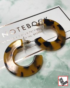 "These yellow and brown tortoise shell hoops are the quintessential earring. These babies are an absolute classic pair! These hoops are flat, and look amazing from any angle. They are an absolute staple in any wardrobe. These resin hoops are the perfect addition to your work outfits as well as your party attire!  They measure approximately 1.25\" in diameter (See image) The stud is made from a hypoallergenic alloy. **FREE SHIPPING IN THE USA AND CANADA**" Small Tortoise, Earrings Small Hoop, Earrings Classic, Cherry Earrings, Party Attire, Fruit Earrings, Small Hoop Earrings, Hoops Earrings, Rainbow Earrings