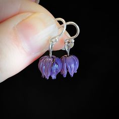 These little blossom earrings are made from lavender-purple glass and are durable and lightweight. These would be a great pair of earrings for someone who needs extremely lightweight earrings or for somebody's first pair of dangling earrings. Celebrate spring! The ear wires are solid sterling silver which is safe for most people with metal allergies. Purple Flower Earrings With Ear Wire For Gift, Purple Flower Earrings With Ear Wire As Gift, Purple Hypoallergenic Flower Drop Earrings, Purple Hypoallergenic Drop Flower Earrings, Hypoallergenic Purple Flower Drop Earrings, Lavender Dangle Flower Earrings, Purple Dangle Flower Earrings, Nickel-free Purple Drop Flower Earrings, Purple Nickel-free Drop Flower Earrings