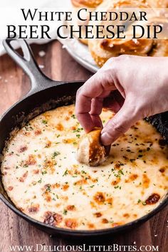 a person dipping cheese into a skillet