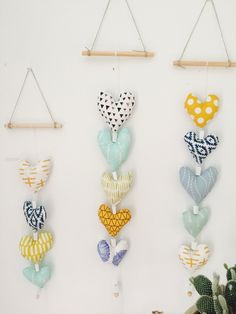 there are many hearts hanging on the wall