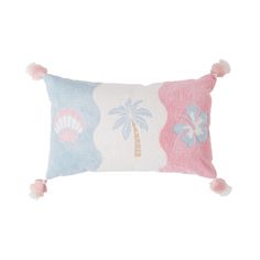 a pink and blue pillow with pom poms