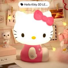 a hello kitty lamp sitting on top of a table