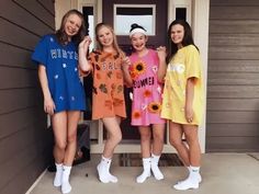 three girls standing in front of a door with sunflowers on their shirts and white socks