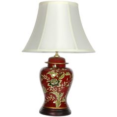 a red and gold vase lamp with a white shade