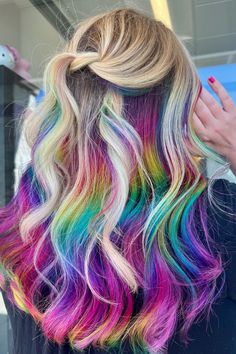 Blonde Hair with Rainbow Peekaboo- Add a playful twist to your look with blonde hair with rainbow peekaboo! Perfect for summer hairstyles for long hair, this balayage blonde hair long style with a rainbow underneath will make a bold statement. Discover the magic of blonde and rainbow hair……  blonde and rainbow hair short, blonde rainbow hair ,  Balayage Blonde Hair Long Rainbow Hair Peekaboo, Short Unicorn Hair, Rainbow Blonde Hair, Blonde Hair With Fun Colors, Fun Blonde Hair Color