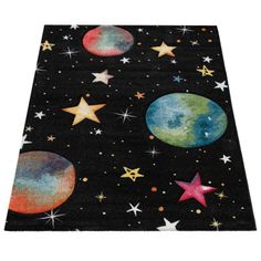 an area rug with stars and planets on it