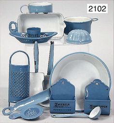 a blue and white porcelain kitchen set with utensils in the shape of dishes