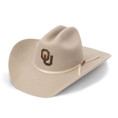 Howdy, Oklahoma Sooners fans! Spruce up your wardrobe with a little country flair courtesy of this Authentic Felt Cowboy Hat. Exquisite details from USCAPE x Seager adorn the debut design, including a 4 1/2" cattleman crown, 4" brim with Western Flange and two-cord ribbon hat-band with a custom Oklahoma Sooners pin. A brown leather sweatband with gold foil and a sleek black silk liner ensures deluxe comfort for the wearer. It is one mighty fine piece of headwear for the modern Oklahoma Sooners supporter. Country Style Felt Cap Hat, Country Style Felt Cap, Country Style Cap Shaped Felt Hat, Fitted Cap Felt Hat For Rodeo, Country Style Outdoor Felt Cap, Country Style Cap For Country Events, Country Style Ranch Hats, Fitted Cap For Rodeo, Country Style Cap For Rodeo