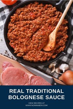 a skillet filled with meat and vegetables on top of a checkered table cloth