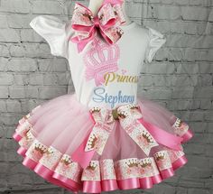 This beautiful  crown ballerina tutu will look adorabe on your little girl.  The tutu is made with pink tulle, pink satin ribbon and ballet dancer ribbon.  The ribbon is embossed with ballerina dresses and slippers.  The shirt can be personalized with their initials.   Your little girl will love this tutu and feel like a balleria. Please read my ANNOUNCEMENT PAGE for the current turnaround time before you place an order! NO Refunds/Cancellations once the order is placed. All sales are final  Leaving a need-by date doesn't mean you'll receive it by/on that date. If it's NOT WITHIN my current turnaround time YOU must reach out to me so that we can agree on a different turnaround (processing AND shipping time estimates) for any date that falls before. Additional fees WILL apply as Time is Mon Tutu And Crown, Ballerina Dresses, Tulle Pink, Ribbon Tutu, Tutu Pink, Ballerina Tutu, Girls Crown, Ballerina Dress, Ballerina Slippers