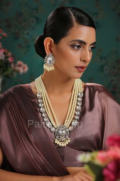 The Polki and Pearls Victorian Necklace set is handcrafted with contemporary Indian Jewelry-making methods by the artisans with elements like high-grade Polki and shell pearls. This Victorian necklace set is a modern fusion of the age-old Polki and Pearls technique with a modern weave of the liking of a new-age woman. This 22k Gold and Rhodium plated silver alloy necklace is a beautiful pick to enhance your appearance. Magnify your looks with our Polki and Pearls Necklace set and get swayed with Traditional Pearl Jewelry Sets For Reception, Traditional Jewelry Sets With Pearl Drop For Reception, Hand Set Chandbali Pearl Necklace For Diwali, Traditional Pearl Drop Jewelry Sets For Reception, Traditional Kundan Necklace With Pearl Drop For Reception, Silver Bollywood Necklace With Pearl Drop, Pearl Drop Necklace For Diwali Celebration, Chandbali Pearl Necklace For Diwali Reception, Bollywood Pearl Necklace For Diwali Celebration