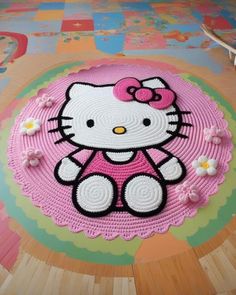 a hello kitty rug is on the floor