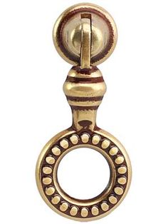 an antique brass door handle with a ball on the front and back end, set against a white background