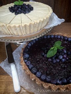 there are two pies on the table and one is blueberries