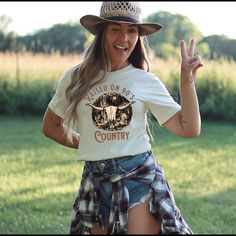 Were you raised on 90's country? Show your country spirit in this soft and comfortable T-shirt with a great fit. This is a perfect concert Tee. Great to wear to your next country concert with a pair of jeans. Please refer to sizing chart to find your perfect fit If unsure, measure if necessary. If you prefer a fitted or more looser fit, please order accordingly. These t-shirts are printed as they are ordered, therefore we cannot accept returns or exchanges. However, please feel free to contact u Casual T-shirt For Western-themed Fall Events, Summer Graphic Tee For Western-themed Events, Retro T-shirt For Western-themed Summer Events, Retro T-shirt For Summer Country Concerts, Retro Summer T-shirt For Western-themed Events, Graphic Tee For Western-themed Spring Events, Crew Neck T-shirt For Western-themed Spring Events, Spring Graphic Tee For Western-themed Events, Fall T-shirt With Graphic Print For Rodeo