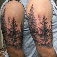 a man's arm with trees on it