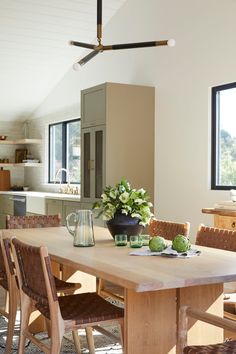 Styled photo of Live Edge Oak Dining Table in a dining room setting with Saddle Woven Leather Dining Chairs and Antique Clay Pot. - Saffron and Poe Woven Leather Dining Chair, California Casual Style, Antique Clay Pots, Woven Dining Chairs, Leather Counter Stools, Leather Dining Chair, Leather Lounge Chair, Live Edge Table