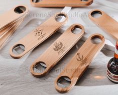 several wooden bottle openers are sitting on a table