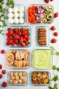 six containers filled with different types of food including strawberries, eggs, and other foods