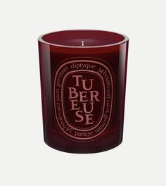 a red candle with the words tu ber fuse on it and an oval design