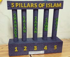 a wooden bench with numbers on it and the words 5 pillars of islam written in gold