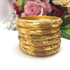 Handmade Indian Bridal Jewellery 22ct Micro Gold Plated 6 Bangles  Pakistani Indian Gold Plated Jewelry Set Of 6 PLEASE NOTE, This Item Is Not Real Gold .Only Good Quality Gold Plated Jewellery .This is Artificial Jewellery.  Traditional Indian Wedding Jewellery Slight Colour variations possible due to difference in screen and photograph  It is a perfect match with formal attire on special occasions or with casual wearing Care instructions Keep Jewellery away from direct heat, water, perfumes, d Handmade Gold Bracelet For Festive Occasion, Gold Round Bollywood Bangle, Gold Bollywood Bangle, Gold Bollywood Bangle For Diwali, Gold Meenakari Bangle, Traditional Yellow Bracelets For Diwali, Bollywood Style Gold Bangle For Diwali, Yellow Bracelets With Intricate Design For Festivals, Traditional Yellow Gold Bracelet For Wedding