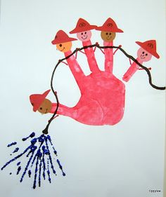 a child's hand is painted in pink and blue