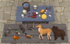 a table with animals and birds on it