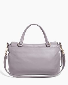 Designed for those who appreciate an effortless grab-and-go aesthetic, this shoulder bag exudes quiet luxury. Featuring the same detailing as the mini version but in a larger size, it incorporates a true handle with an optional, shoulder strap. The flap has a decorative dog clip with a magnetic snap for security. This modern, feminine take on traditional briefcases combines the elements of a contemporary messenger bag with a convenient top handle. Glove Tanned Leather Signature branded hardware Luxury Everyday Satchel Bag With Top Carry Handle, Luxury Everyday Satchel With Top Carry Handle, Versatile Satchel With Round Handle For On-the-go, Top Handle Flap Bag With Removable Pouch For On-the-go, Versatile Top Handle Flap Bag, Versatile Shoulder Bag With Detachable Strap And Top Handle, Versatile Shoulder Bag With Detachable Strap, Versatile Top Handle Shoulder Bag With Detachable Strap, On-the-go Crossbody Flap Bag With Detachable Handle