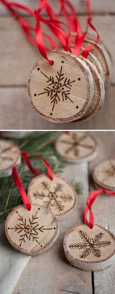 three wooden ornaments with red ribbons on them and one is decorated with snowflakes