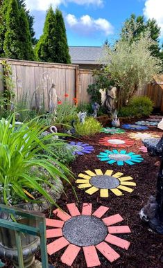 a garden with flowers and plants in the center, surrounded by other landscaping items that are painted like sunflowers