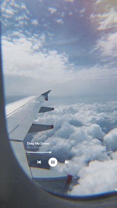 the view from an airplane window shows clouds, and there is no image on it