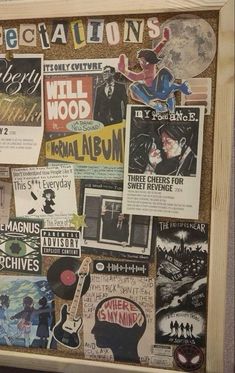 a bulletin board with various posters on it