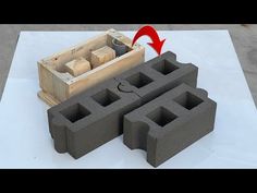 an object made out of cinder blocks with a red arrow pointing to the block that is in